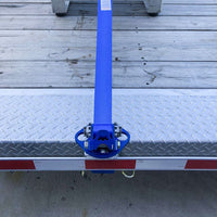MAC's open trailer stake pocket tie-down ratchet strap insert for secure towing and load stabilization with tow hooks.