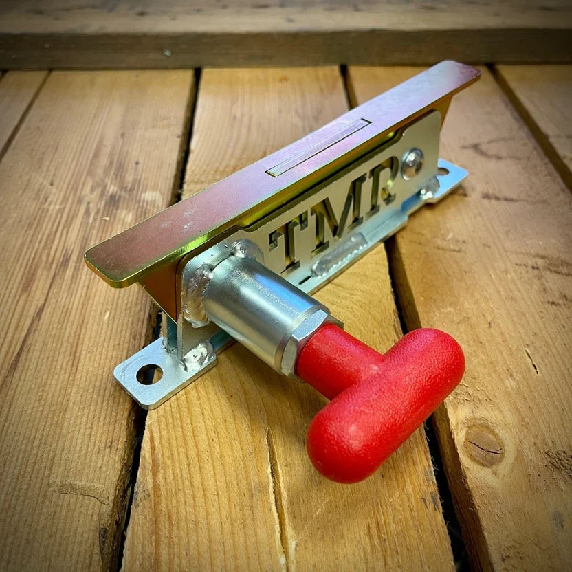 TMR Custom USA portable handheld fire extinguisher mount for auto and shop fire safety, shown on a wall with extinguisher attached.